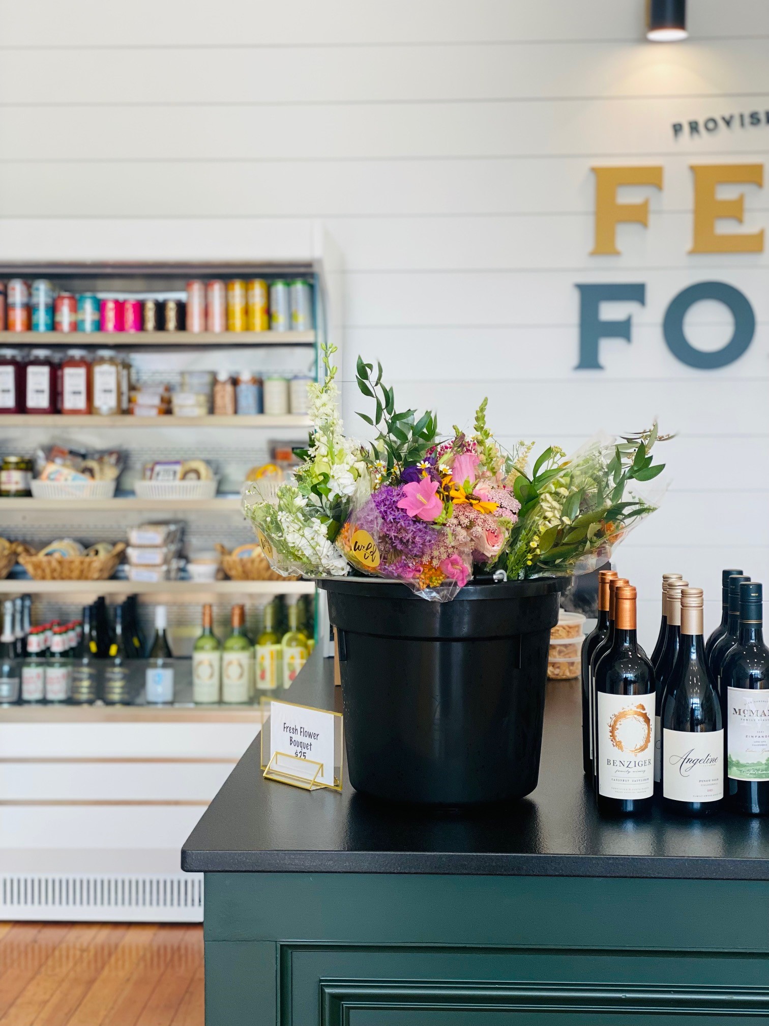 feed and foster 2 Flowers on counter at Feed and Foster