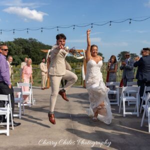 Summerset Winery bride and groom celebrating down the aisle