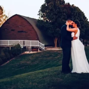 Bailey Farms bride and groom outside infront of a barn